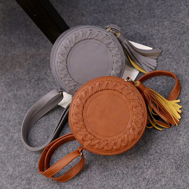 New Korean version of the trend tassels small round bag fashion creative shoulder diagonal cross-bun packet small bag trend handbags