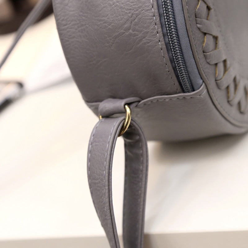 New Korean version of the trend tassels small round bag fashion creative shoulder diagonal cross-bun packet small bag trend handbags