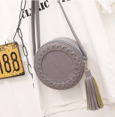 New Korean version of the trend tassels small round bag fashion creative shoulder diagonal cross-bun packet small bag trend handbags