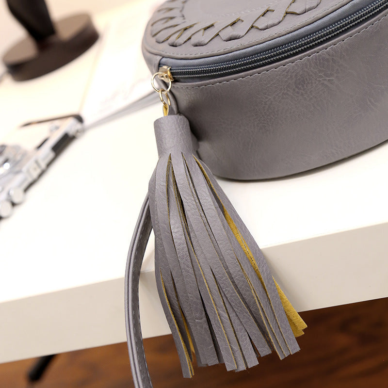 New Korean version of the trend tassels small round bag fashion creative shoulder diagonal cross-bun packet small bag trend handbags