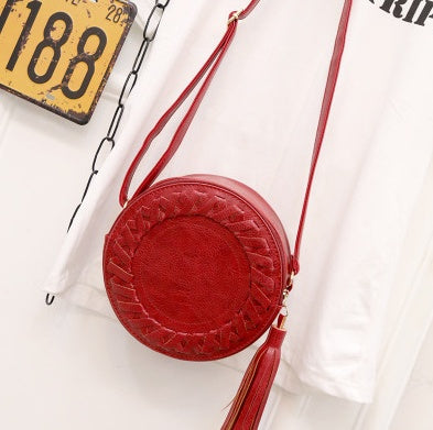 New Korean version of the trend tassels small round bag fashion creative shoulder diagonal cross-bun packet small bag trend handbags